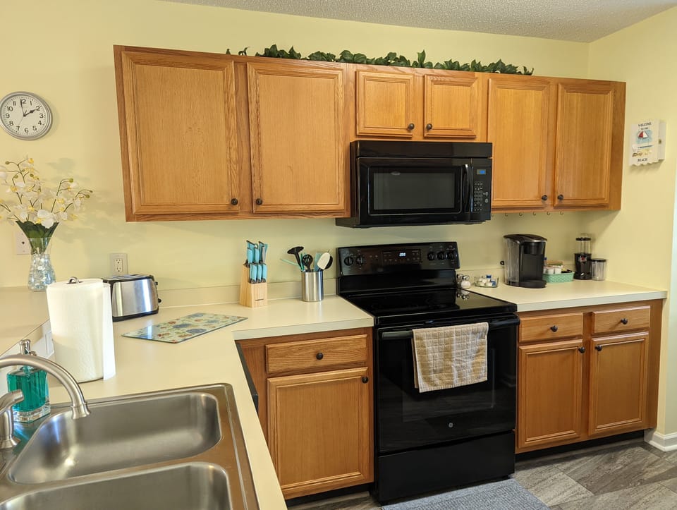 Flat top stove / microwave / coffee maker / blender / coffee and creamer