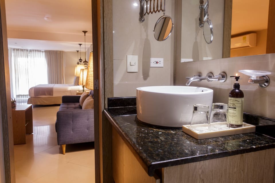 Junior Suite, 1 King Bed with Sofa bed | Bathroom | Shower, rainfall showerhead, hair dryer, towels