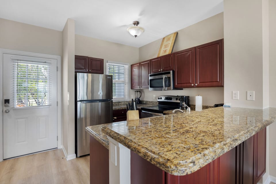 Front door and full kitchen