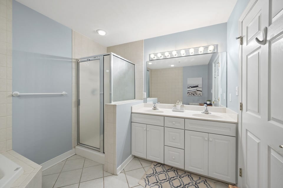 Primary Bath has Dual Vanity, Walk-in Shower, and Soaking Tub.