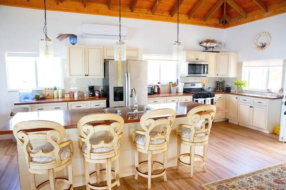 Upper level fully equipped kitchen with bar seating