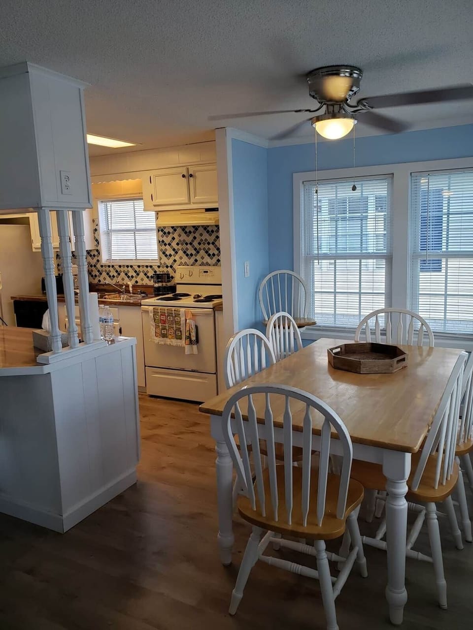 Beautiful dining room table and 6 chairs with a lot of windows to look out over the lake and fountain 