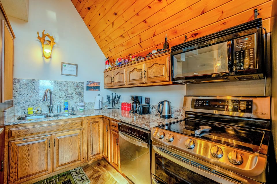 Warm and inviting chalet kitchen with rustic charm and modern convenience.