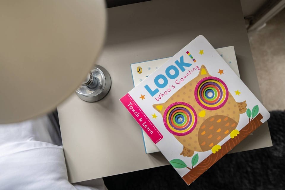 A side table with books at Rose Cottage, Isle of Wight