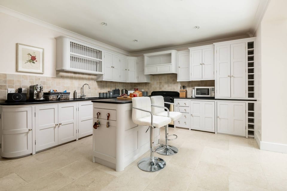 The kitchen with an island at Rose Cottage, Isle of Wight