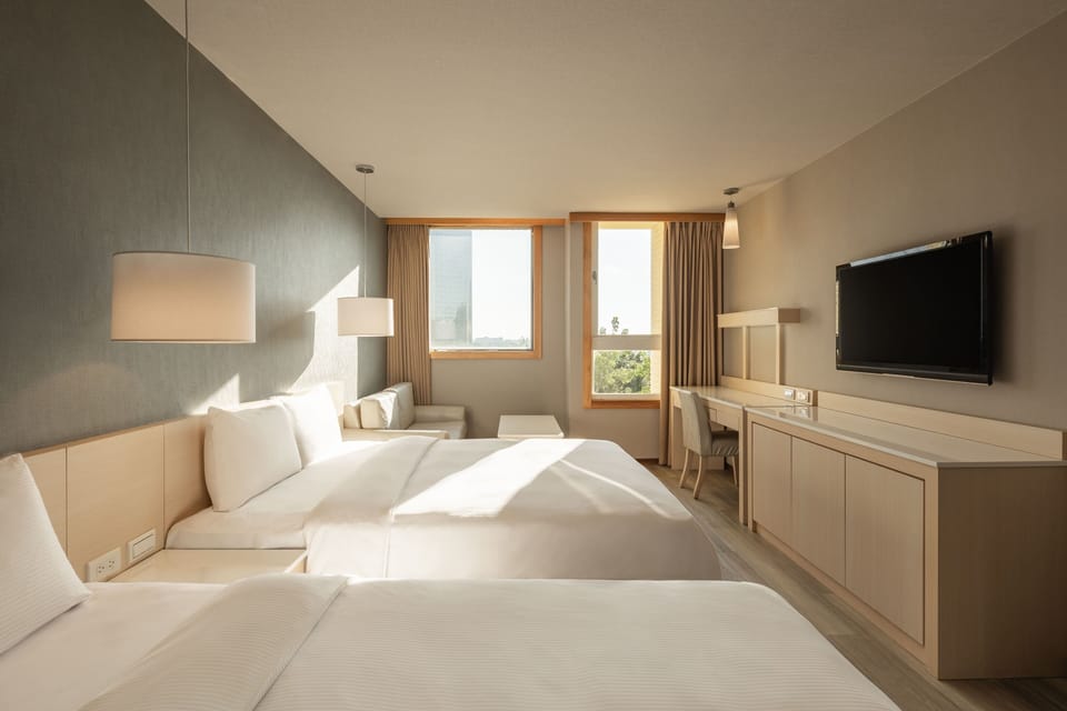 Deluxe Quadruple Room | Premium bedding, down comforters, pillowtop beds, individually decorated