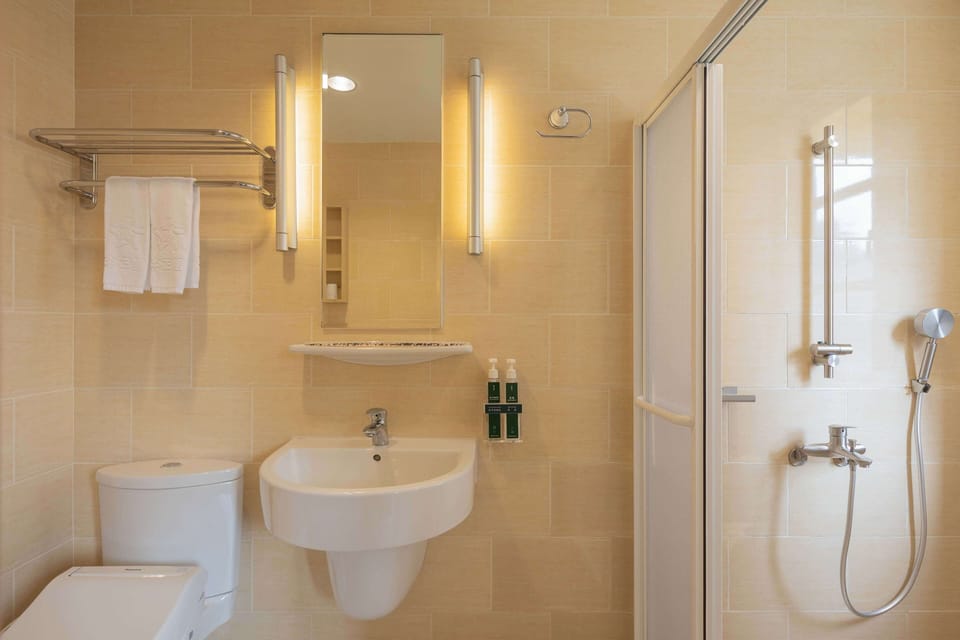 Shower, free toiletries, hair dryer, slippers