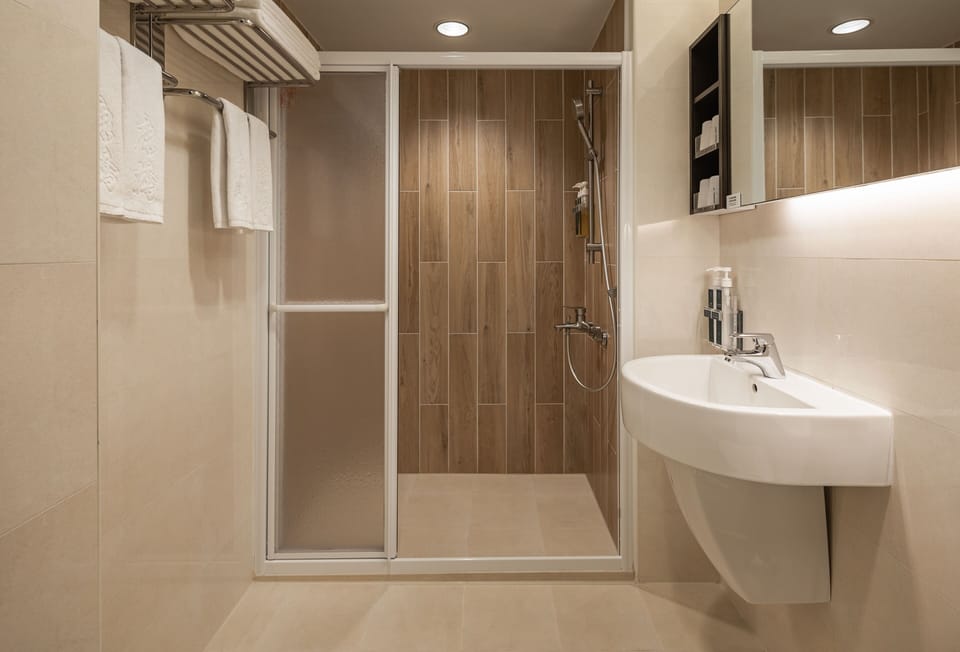 Standard Room, 2 Double Beds | Bathroom | Shower, hydromassage showerhead, hair dryer, slippers