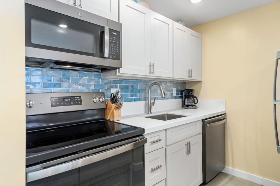 Fully stocked kitchen and new appliances.