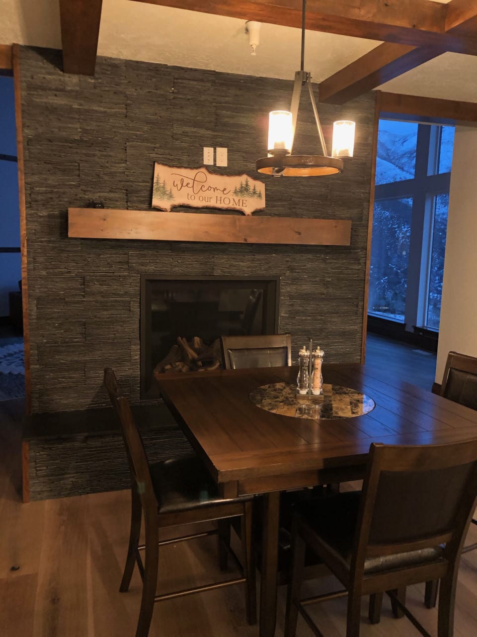 Cozy dining or game table by the fireplace.