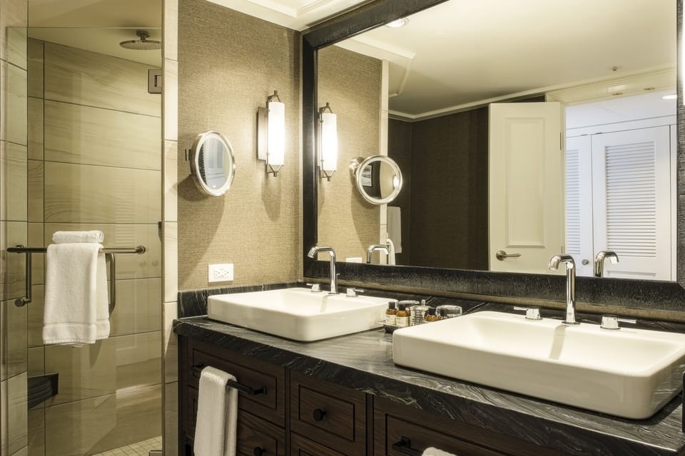 Separate tub and shower, designer toiletries, hair dryer, bathrobes