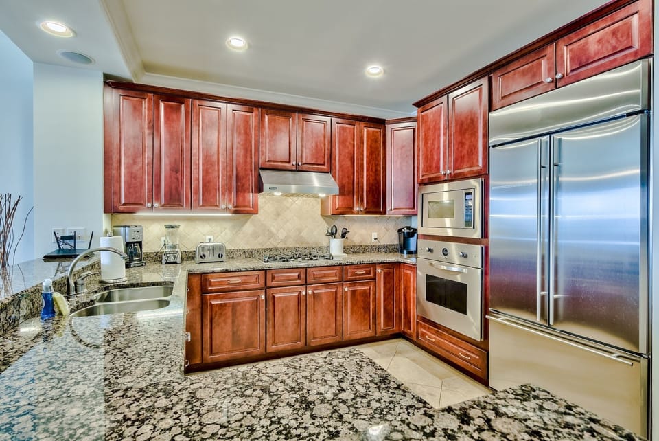 Adagio A402 kitchen - Large double door refrigerator plus new oven, microwave, stand alone icemaker, dishwasher and plenty of dishware and cookware.