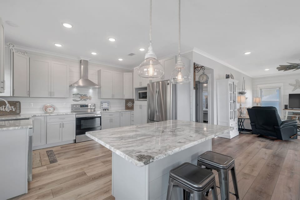 Kitchen island has tons of storage for your dry goods and will seat four. 