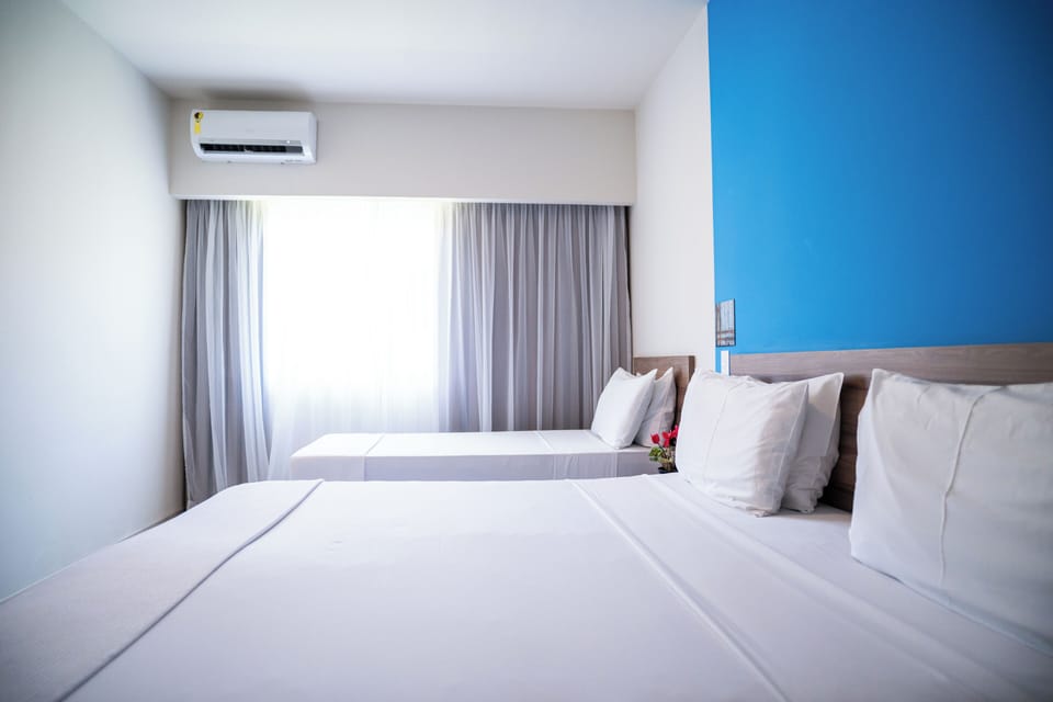 Deluxe Suite, Courtyard View | In-room safe, desk, free WiFi, bed sheets
