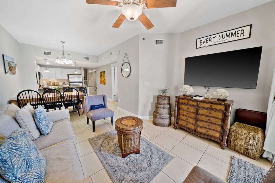 Relax in your bright, open-concept living space with comfortable seating, modern entertainment, and coastal-inspired decor perfect for unwinding after beach days.