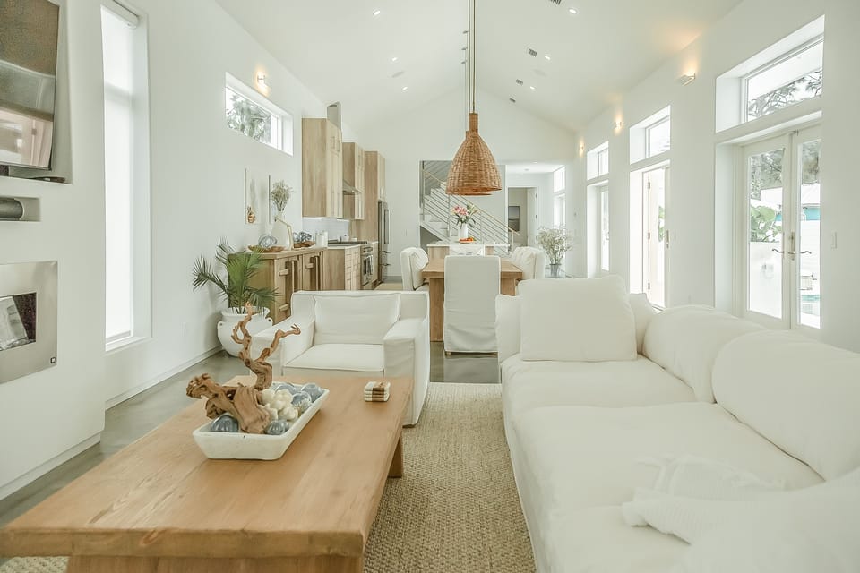 Living area, large comfortable sofa, 65" TV, fireplace.