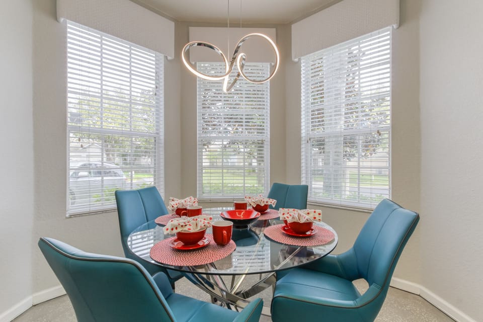 The breakfast nook in the kitchen along with space aged lighting.