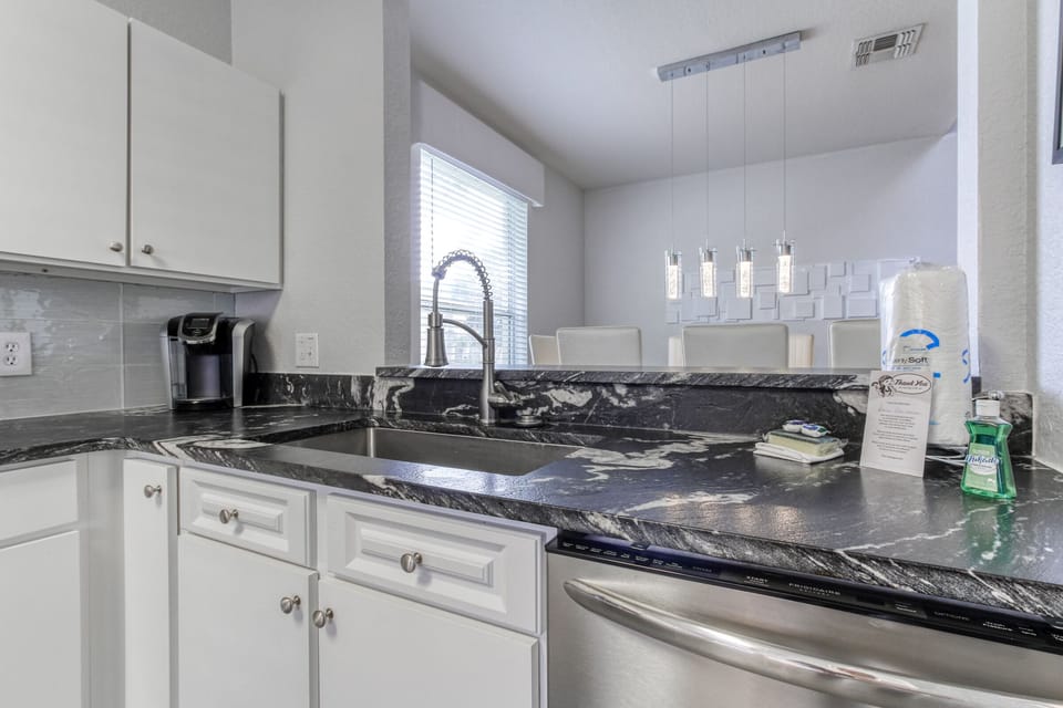 The kitchen has a handy pass-though to the dining room.
