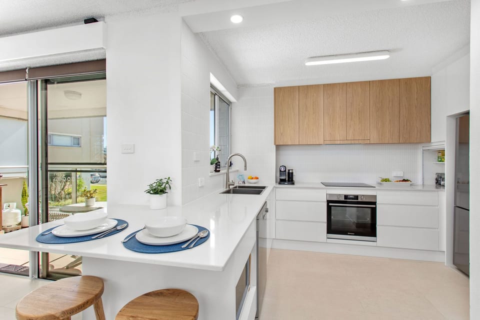 Watch the waves on the beach while enjoying coffee & brekky at the breakfast bar