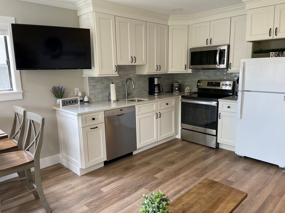 Carolina Beach Club 225 - Kitchen - Plenty of storage in this well equipped kitchen with new appliances and standard coffeemaker.