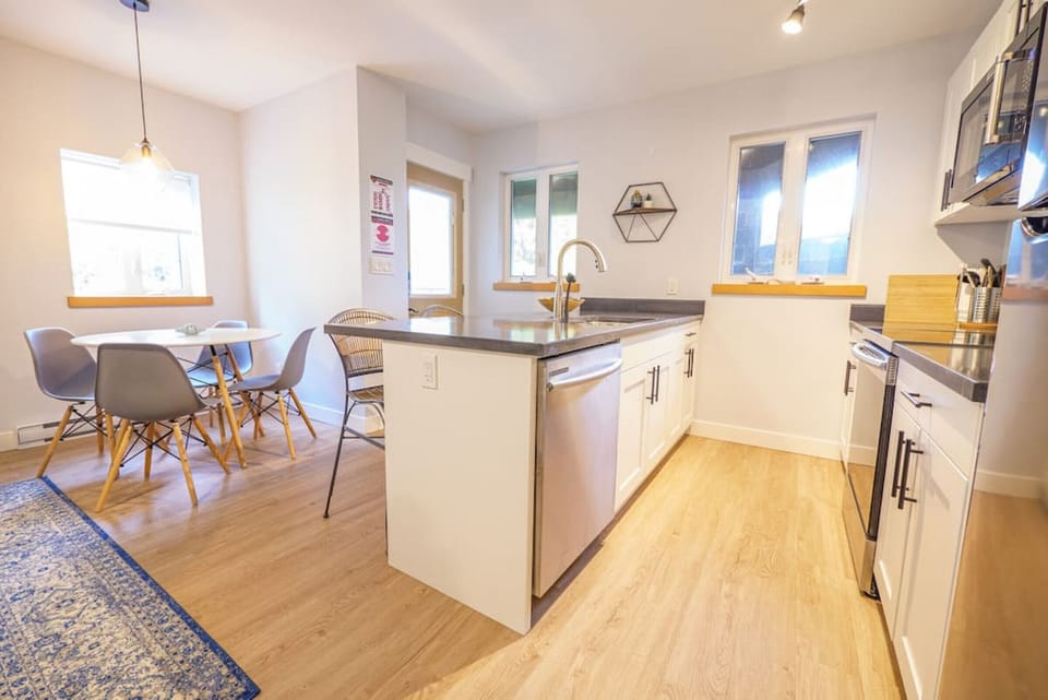 Fully Stock Kitchen with Dishwasher, Stove, Over-The-Range Microwave, and Fridge