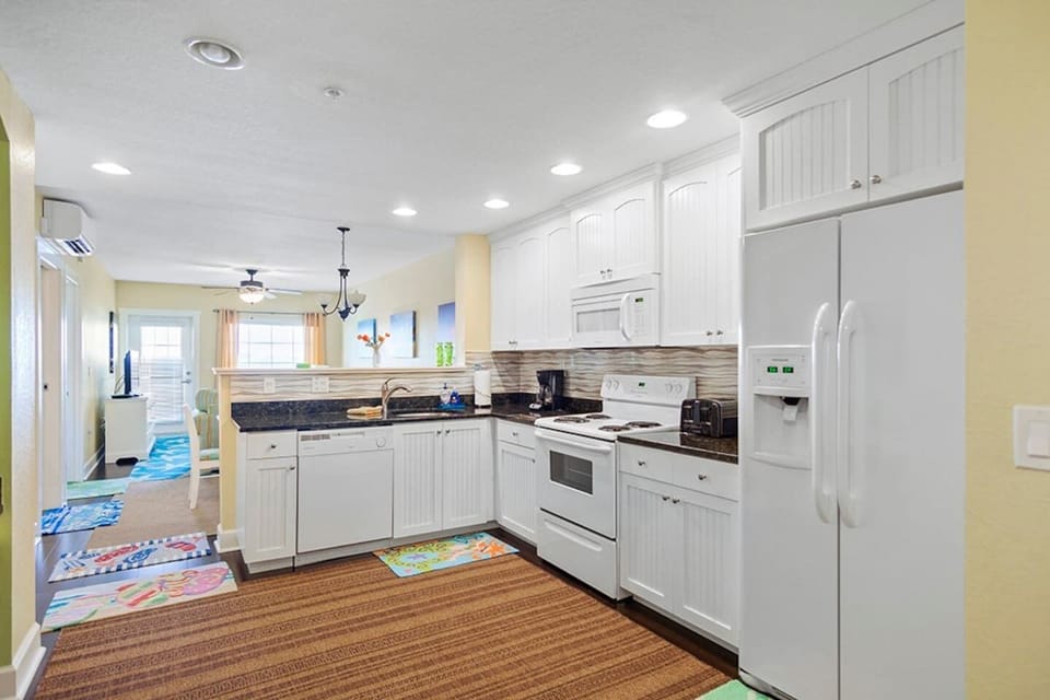 Full Kitchen - Dishes, pots/pans, microwave, dishwasher, full size fridge, stackable washer/dryer and a Mr. Coffee