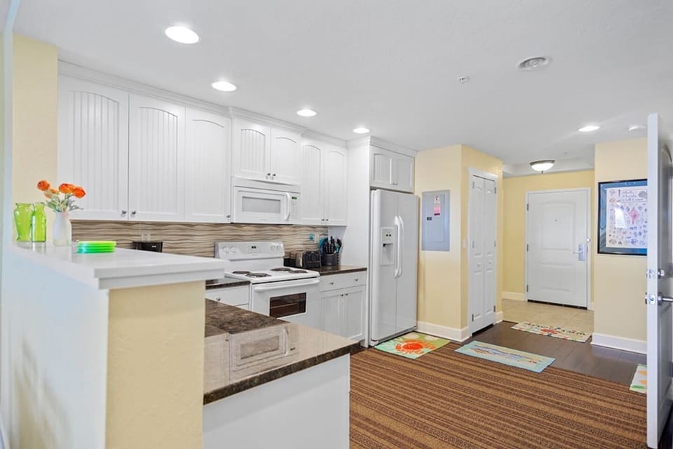 Full kitchen - includes a washer/dryer, dishwasher, microwave, full size fridge, pots/pans, dishes and a Mr. Coffee.