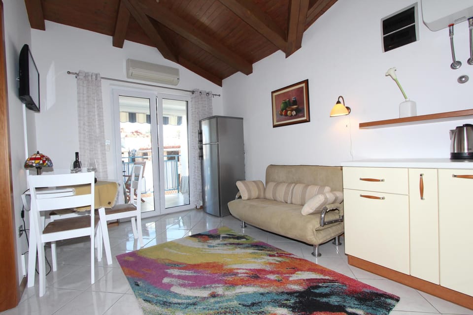 Apartment, 1 Bedroom, Smoking, Balcony | Living area | 40-inch flat-screen TV with satellite channels, TV