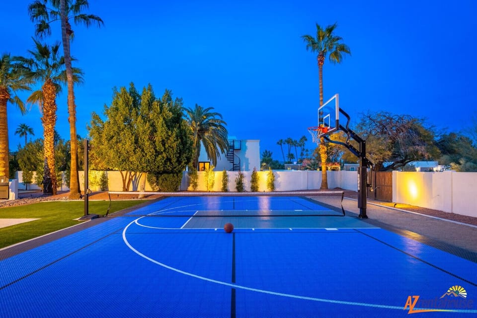 Challenge friends to an evening game on your private basketball court, beautifully lit under the desert sky with palm trees swaying overhead.