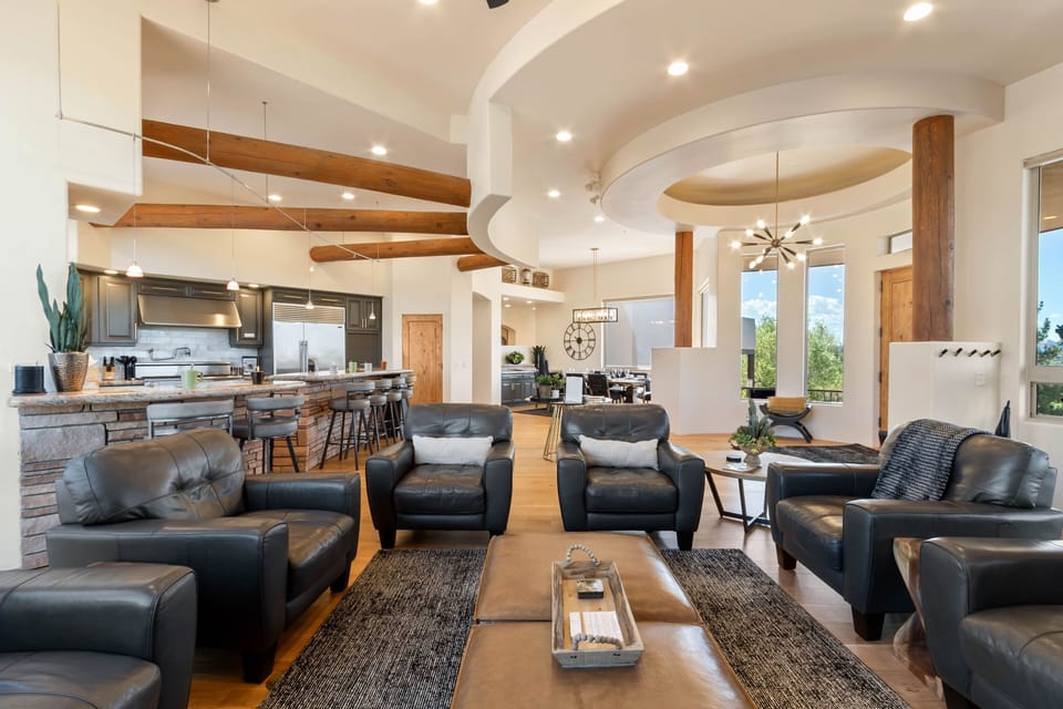 Expansive Living Space with Elevated Design
Soaring ceilings, exposed beams, and designer touches create a warm and spacious gathering area for friends and family.
