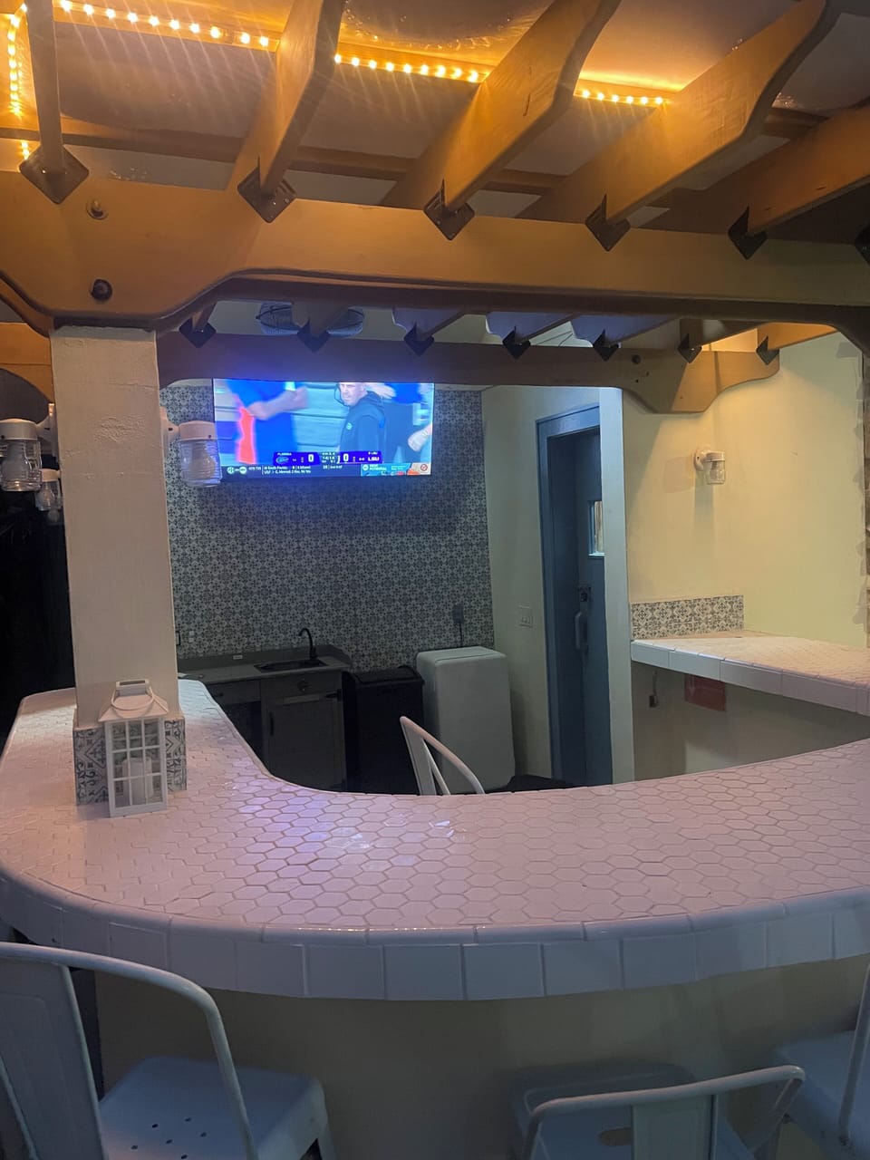 Poolside bar with grill and outdoor tv