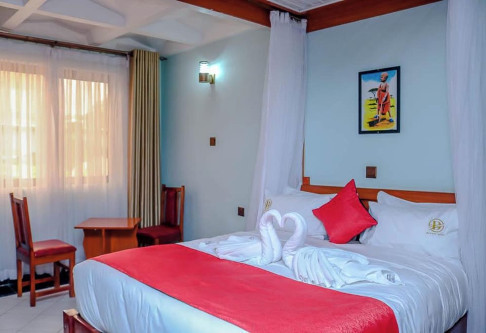 Deluxe Double Room | Minibar, bed sheets