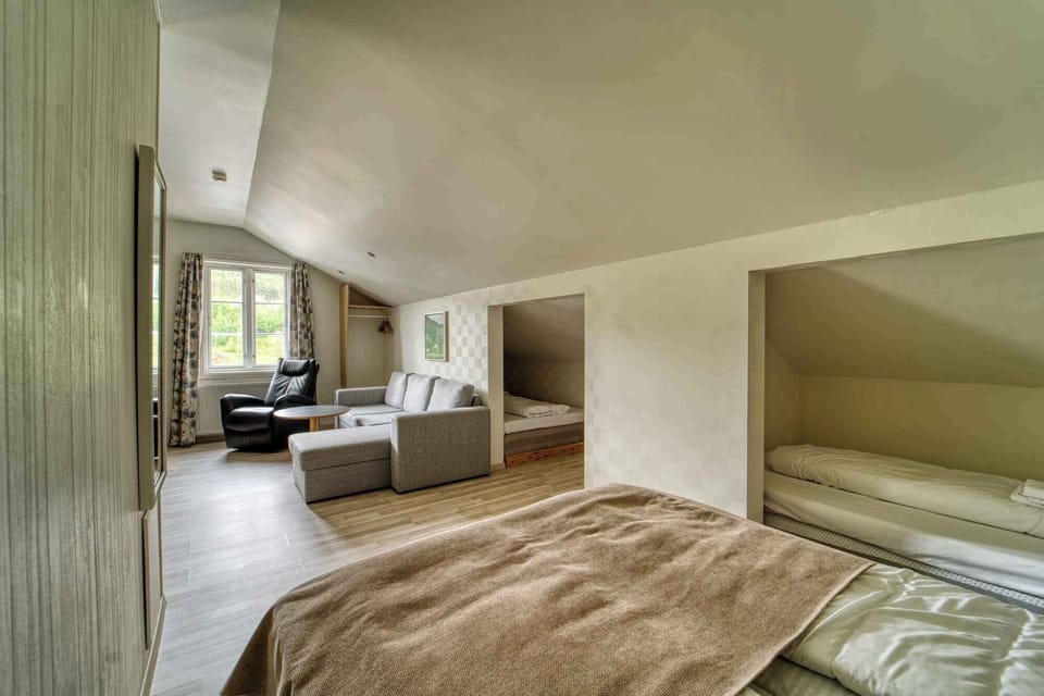 Junior Quadruple Room | Minibar, desk, laptop workspace, soundproofing