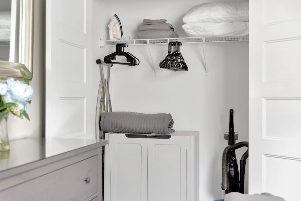 Vacuum, iron and ironing board