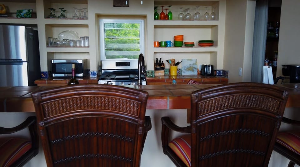 Breakfast bar with four high-top stools.