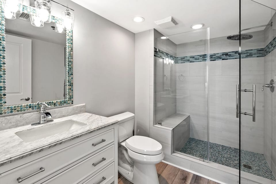 Bathroom with a glass shower enclosure and vanity at Seaside Resort 1201 in Crescent Beach
