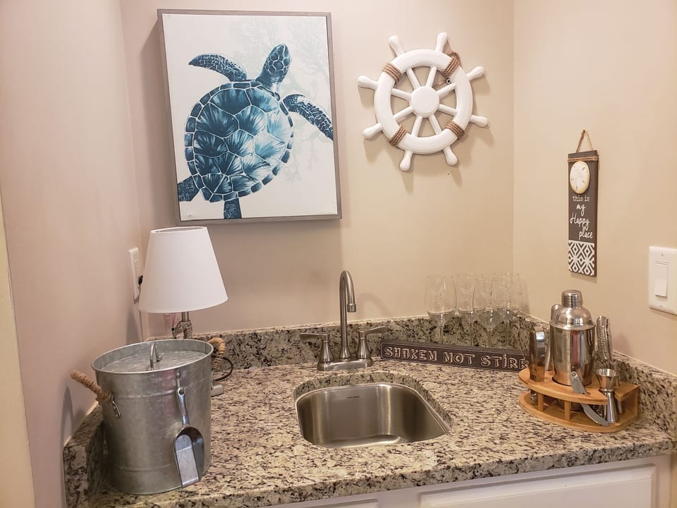 Wet bar to make all your favorite drinks. Puzzles and games in lower cabinet
