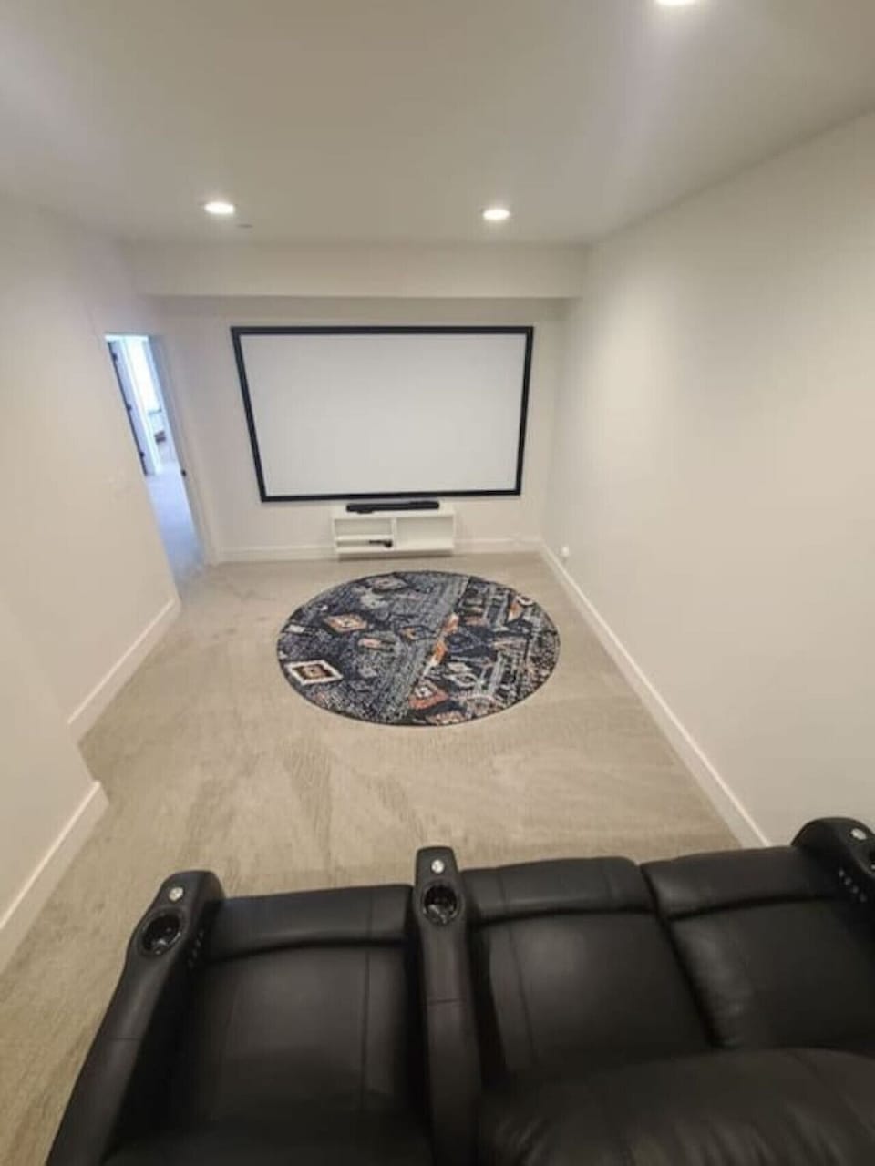 A massive private movie theater with reclining LED seats for the ultimate cinematic experience