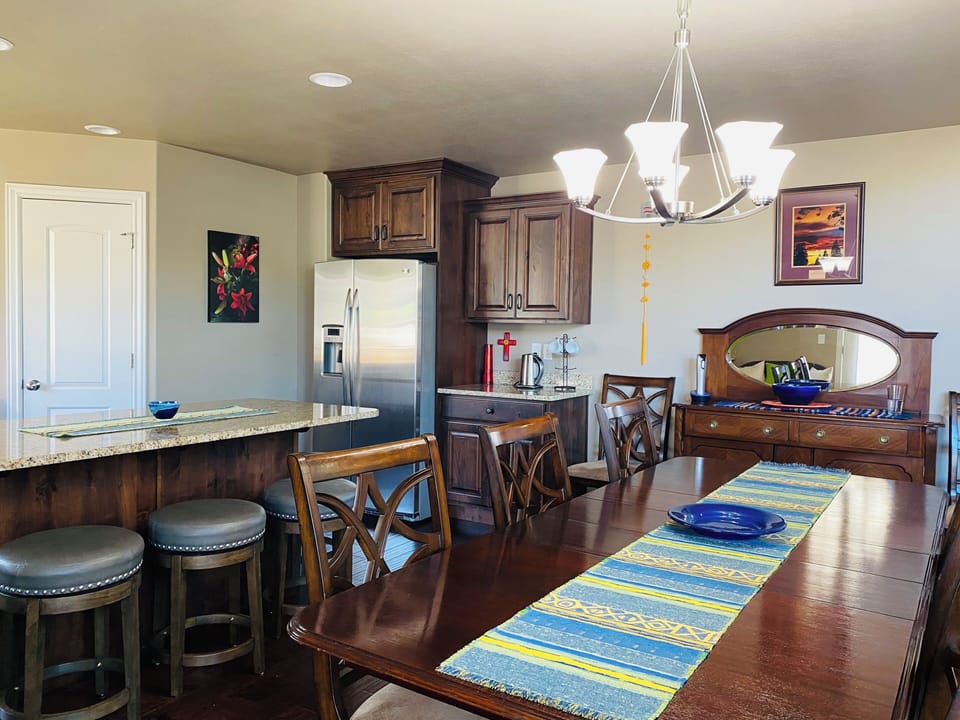 Barware and Tea Bar located next to the refridgerator.