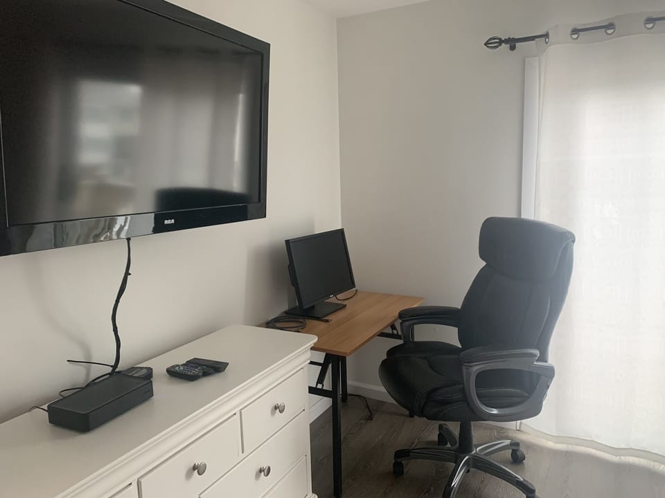 Workspace with 27" computer screen. 