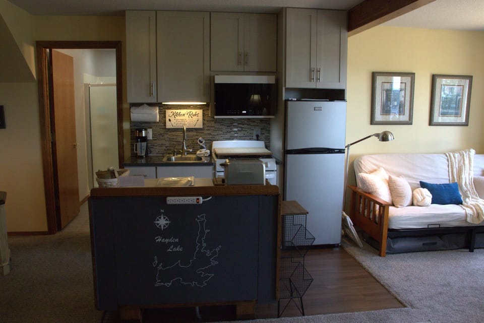 Kitchenette, full-size futon & bathroom—all in one convenient layout.