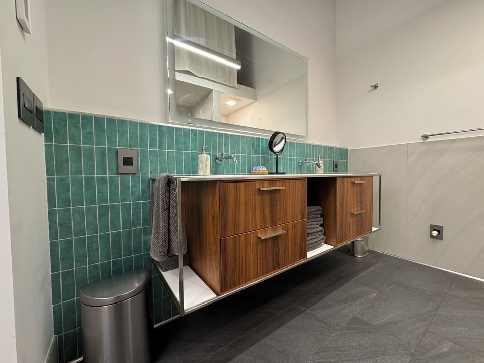 Master vanity with high-end designer tile.