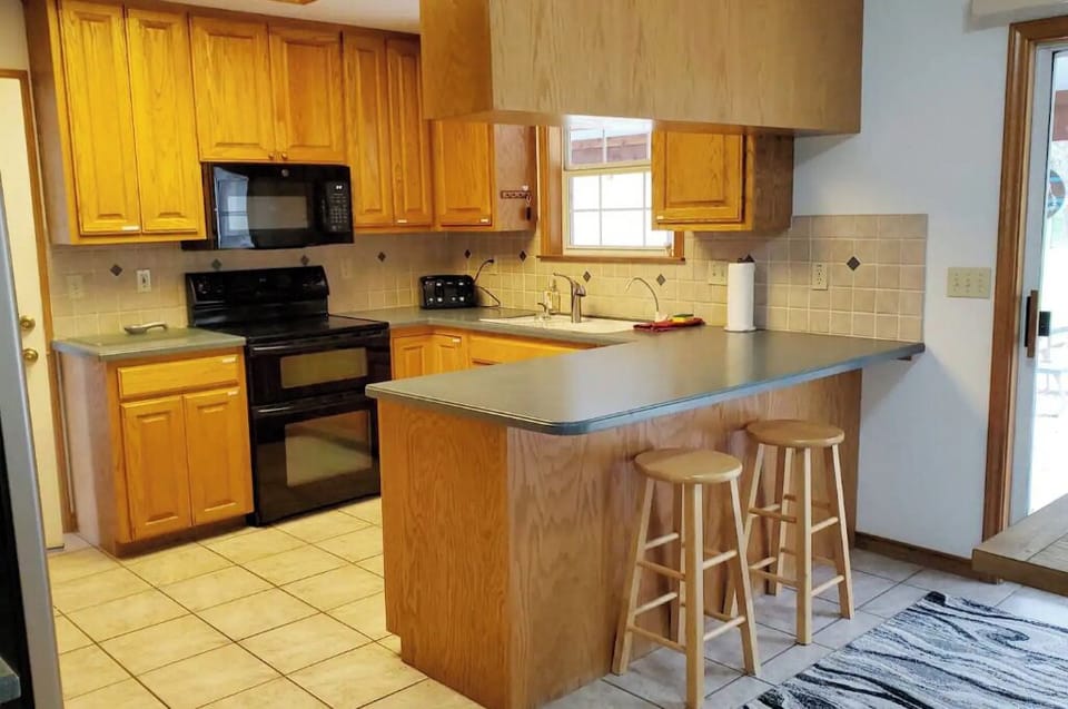 The kitchen is stocked with everything you need to prepare and consume your food