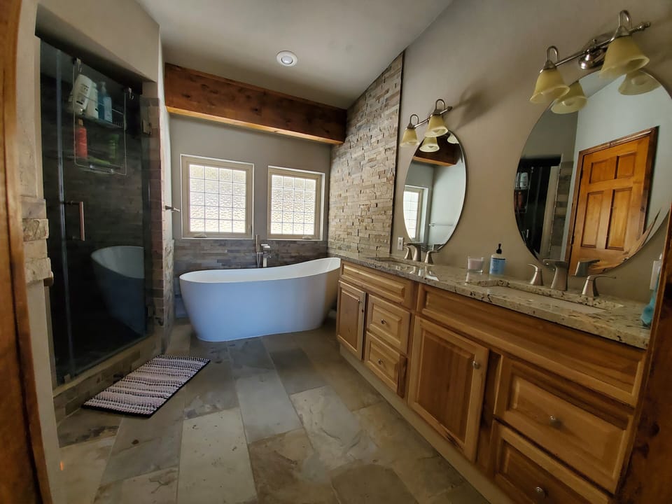 Master ensuite has huge rainfall shower, soaker tub and heated tile floors.