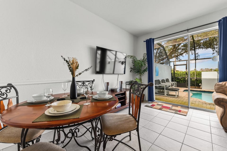 DINING:  Dining area set for four, perfect for enjoying meals with family or friends.