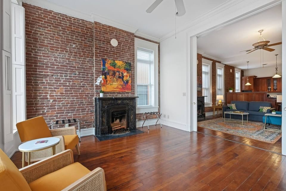 Cozy bedroom sitting area with antique fireplace. Huge double sliding doors can be closed for privacy