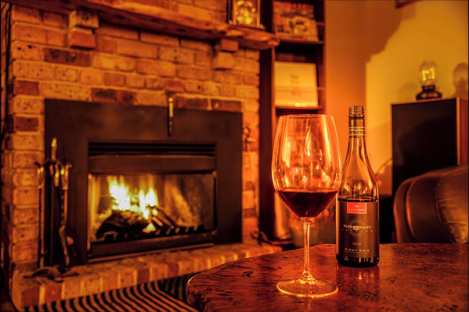 A glass of red is better enjoyed with a log fire