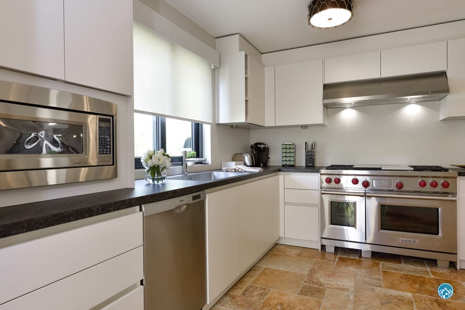 Fully equipped kitchen with gas stove and microwave
