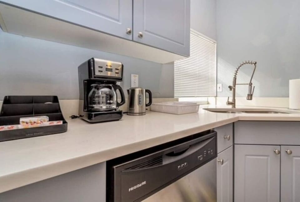 Fully stock kitchens with stainless steel appliances.