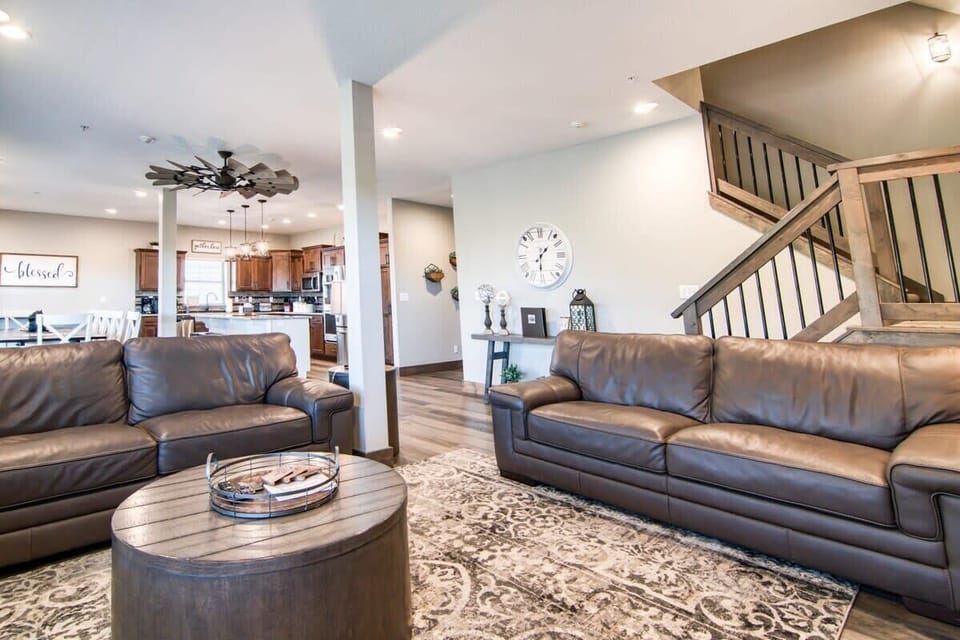 Sink right into the comfort of the couches while also enjoying the company of those in the kitchen!